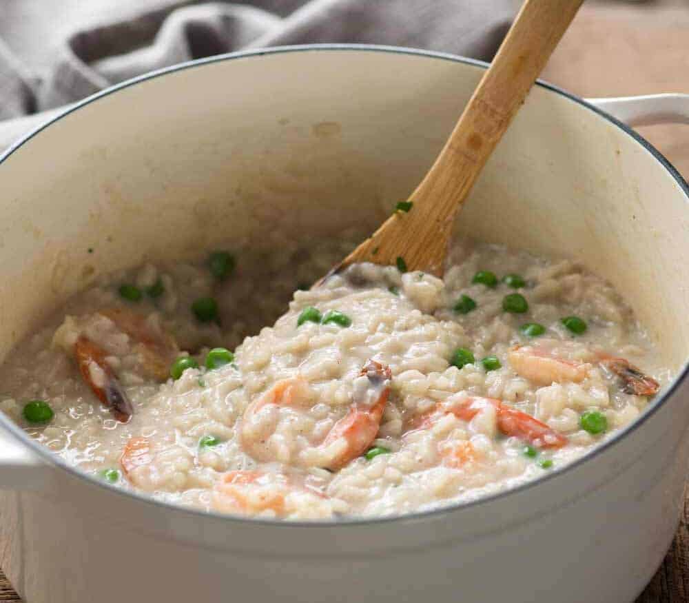 Creamy Prawn Risotto in a white cast iron pot, ready to be served.